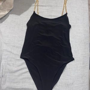 Black bodysuit with gold chain straps
